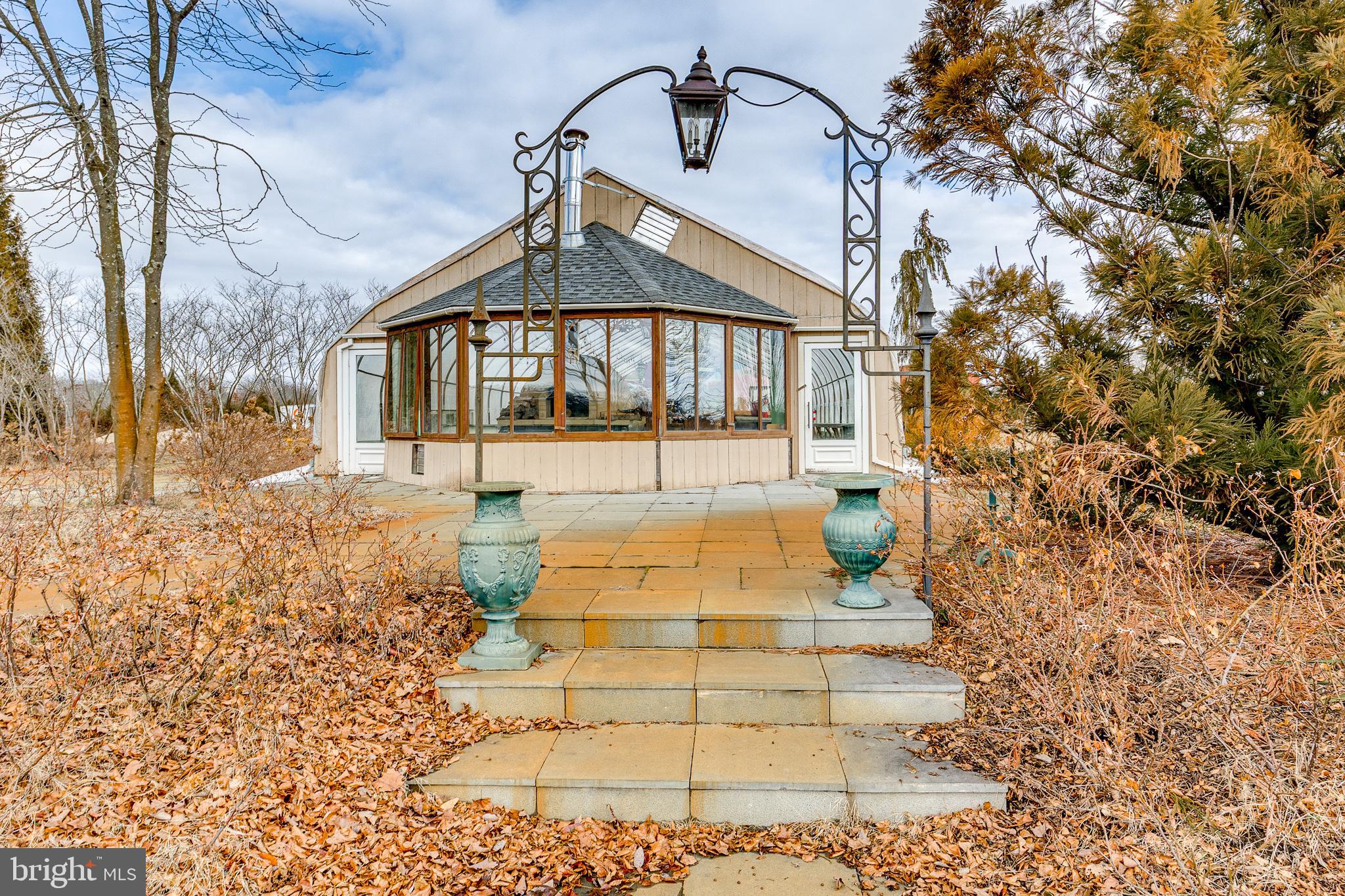 139 Bordentown Georgetown Road Chesterfield, NJ 08515 - Photo 58 of 89 a view of a brick house with large windows