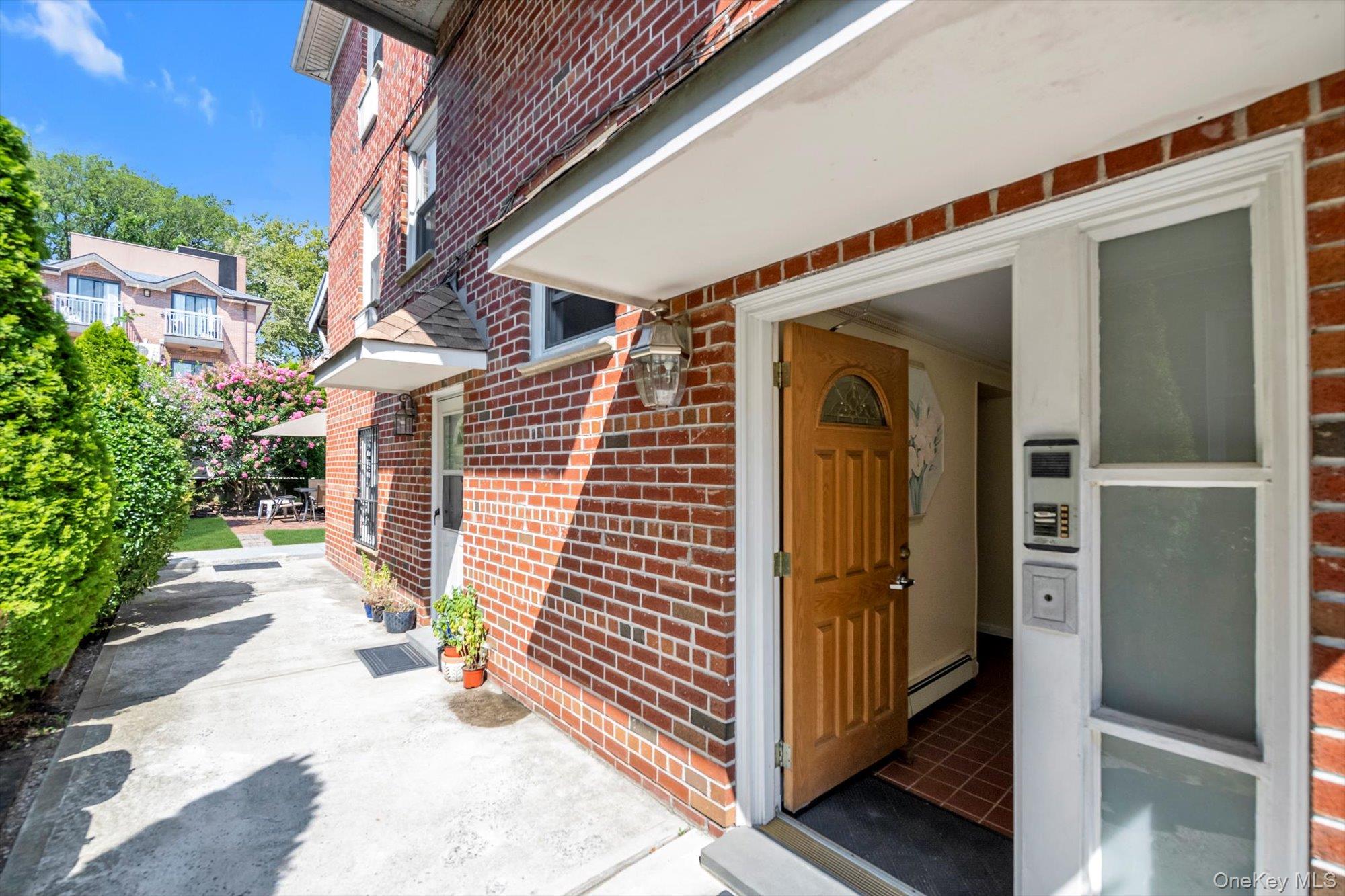 61-26 164th Street Queens, NY 11365 - Photo 2 of 17 a view of a entrance door of the house
