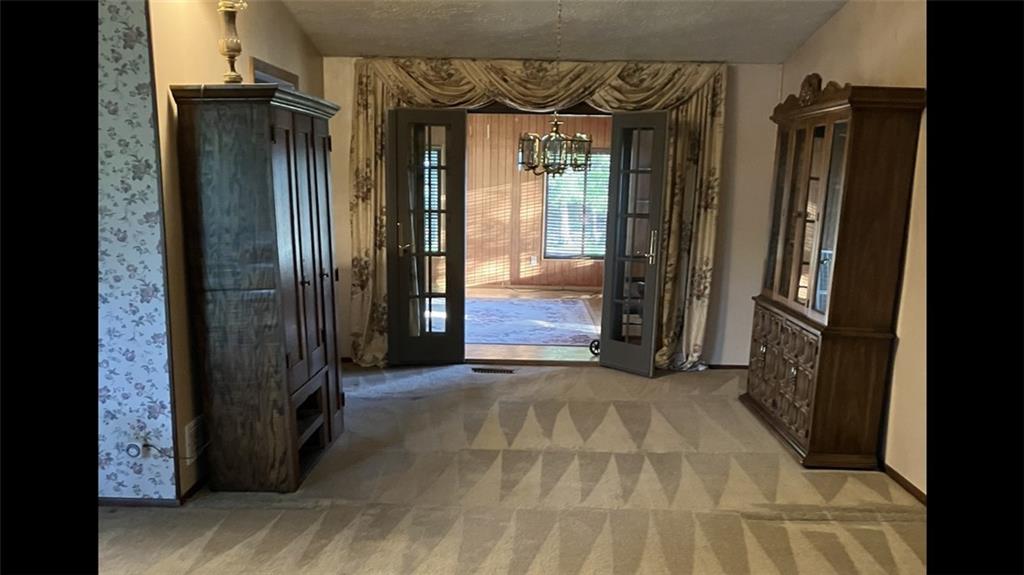 125 Beacon Road Renfrew, PA 16053 - Photo 13 of 31 a view of a hallway with wooden floor and door