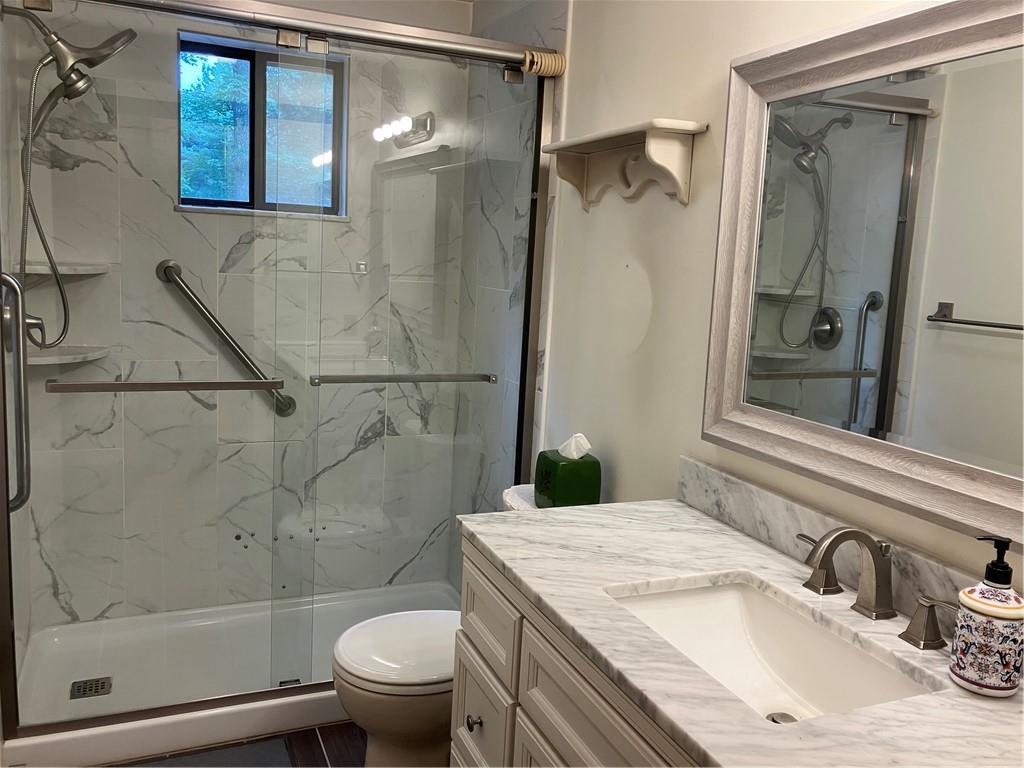 125 Beacon Road Renfrew, PA 16053 - Photo 19 of 31 a bathroom with a granite countertop sink toilet and shower