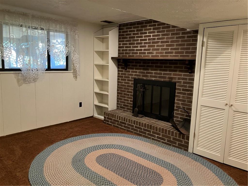 125 Beacon Road Renfrew, PA 16053 - Photo 26 of 31 a view of a livingroom with wooden floor and a fireplace