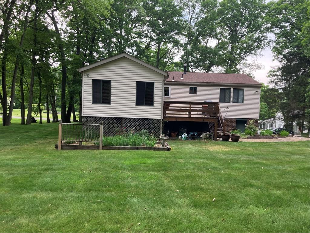 125 Beacon Road Renfrew, PA 16053 - Photo 31 of 31 a front view of a house with a garden and yard