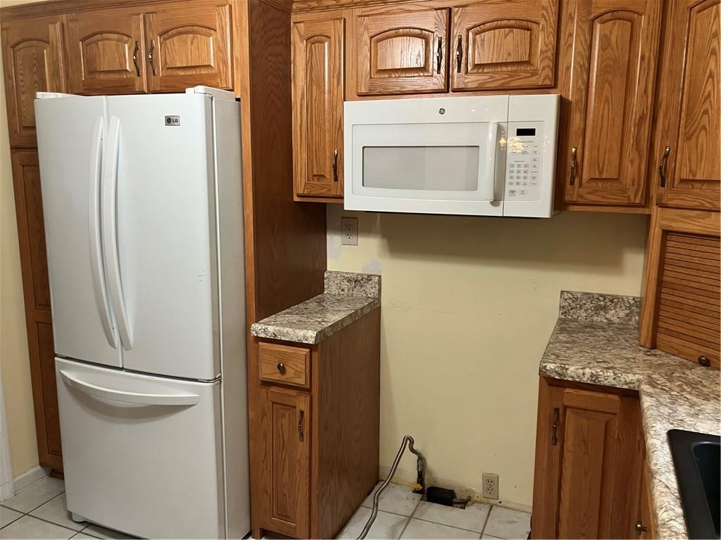 125 Beacon Road Renfrew, PA 16053 - Photo 7 of 31 a kitchen with stainless steel appliances granite countertop a refrigerator and a stove