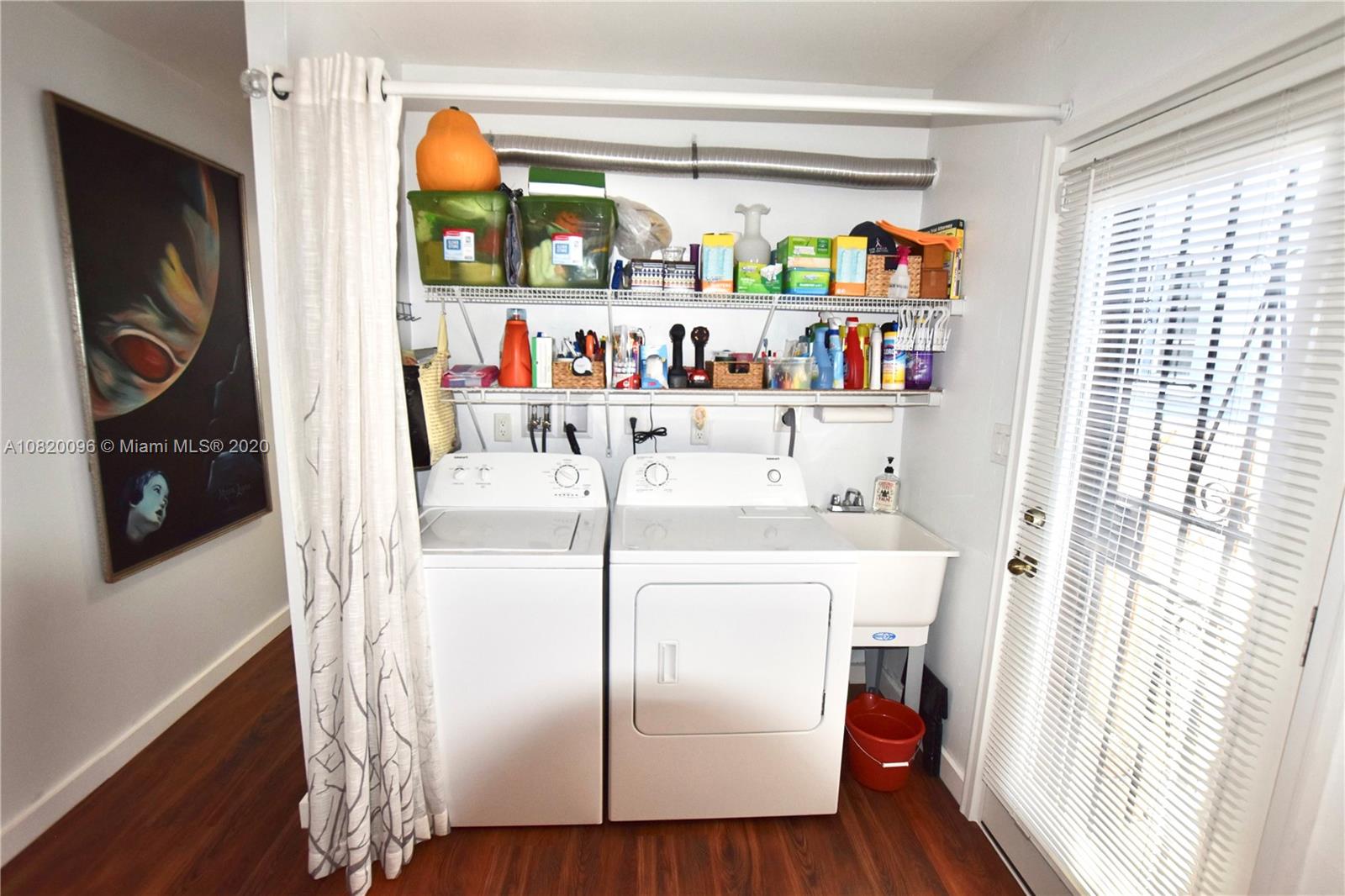 2270 Southwest 24th Street Miami, FL 33145 - Photo 11 of 22 a utility room with dryer washer and a window
