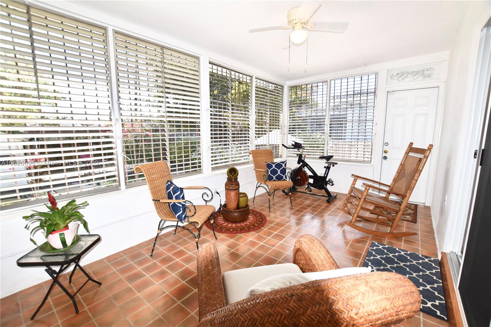 2270 Southwest 24th Street Miami, FL 33145 - Photo 12 of 22 a living room with patio furniture and floor to ceiling windows