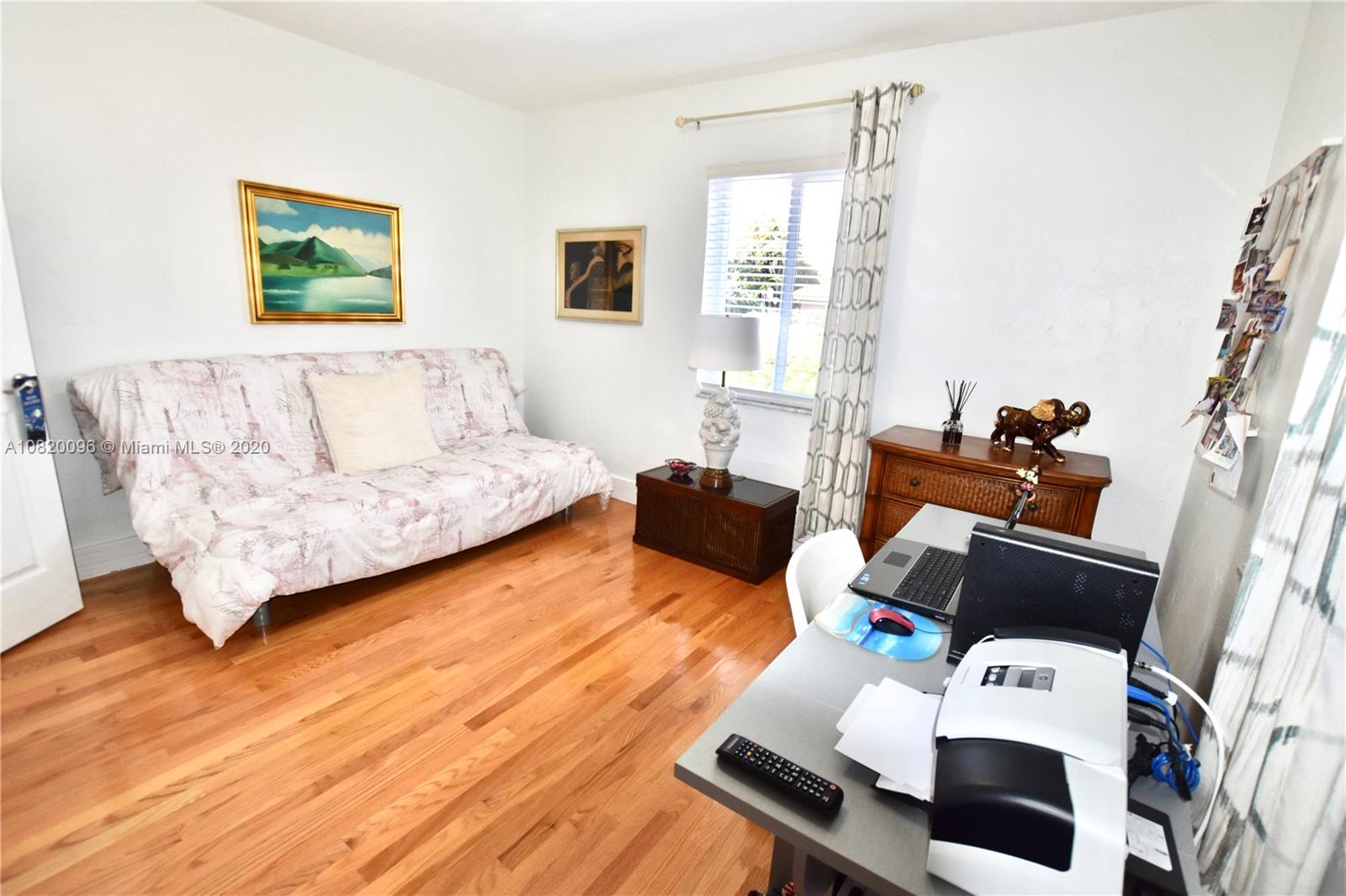 2270 Southwest 24th Street Miami, FL 33145 - Photo 16 of 22 a living room with furniture and a window
