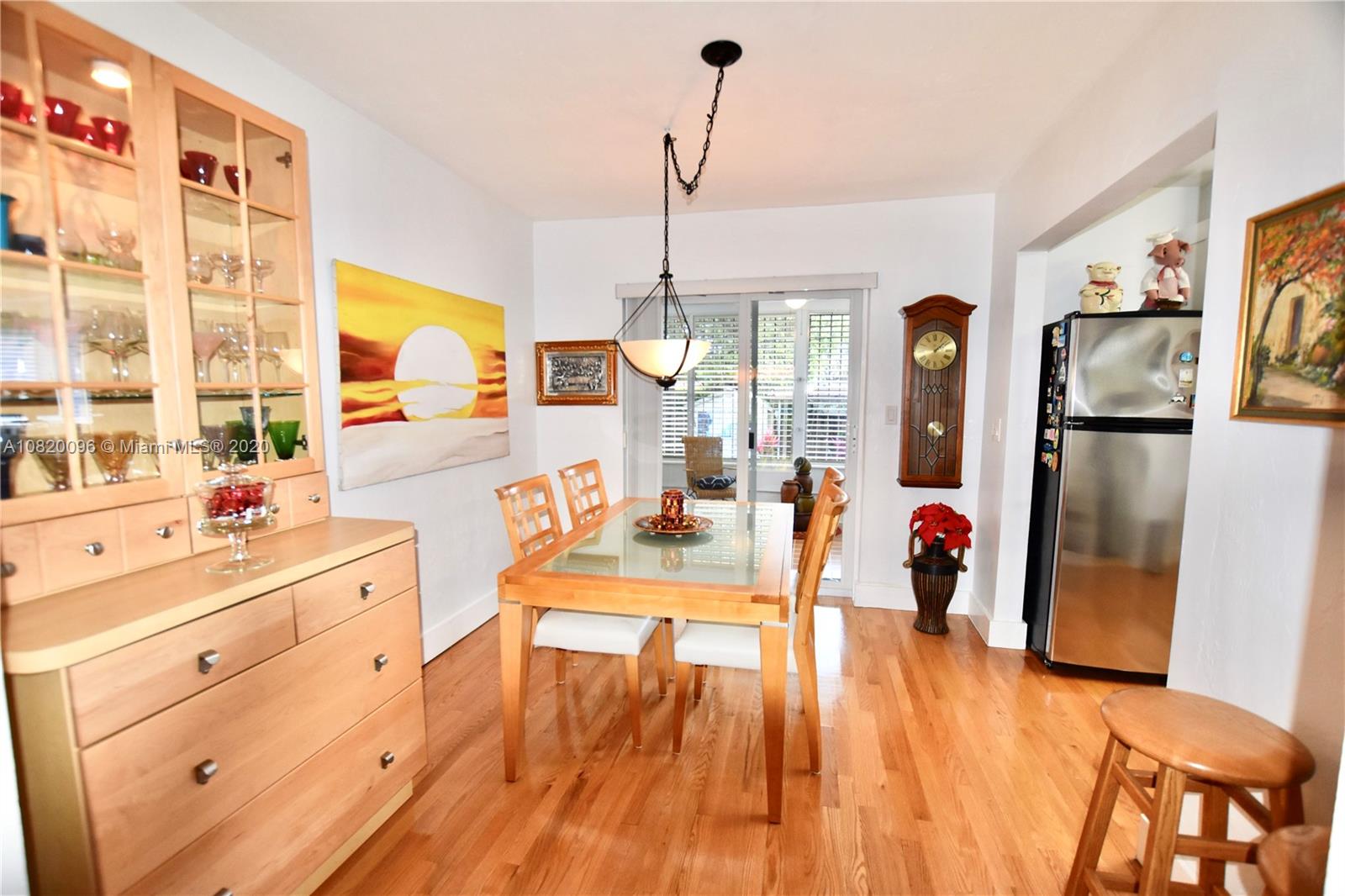 2270 Southwest 24th Street Miami, FL 33145 - Photo 6 of 22 a living room with stainless steel appliances kitchen island granite countertop furniture and a wooden floor