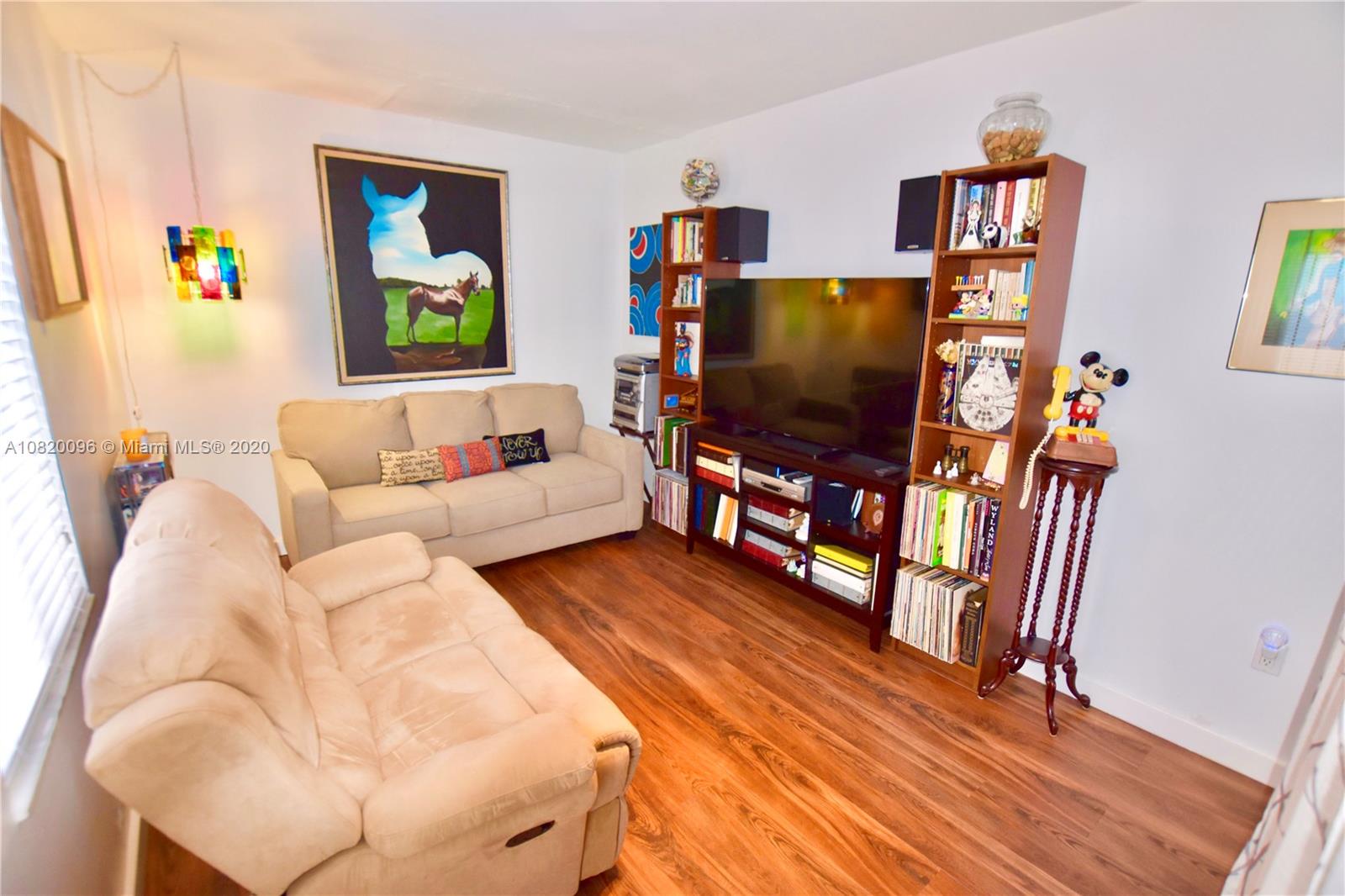 2270 Southwest 24th Street Miami, FL 33145 - Photo 10 of 22 a living room with furniture and a flat screen tv