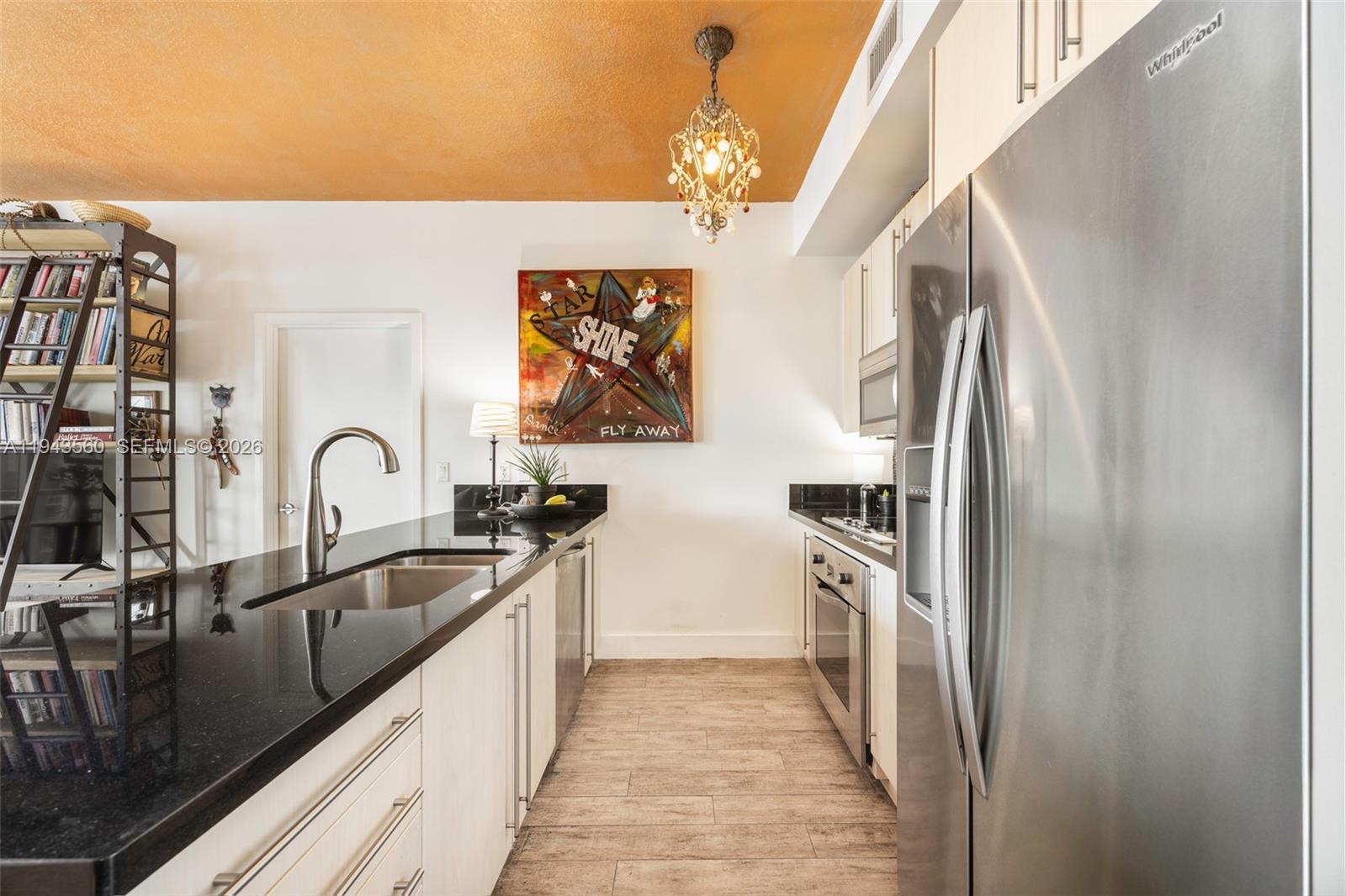 79 Southwest 12th Street, Unit PH3904S Miami, FL 33130 - Photo 8 of 33 a kitchen with stainless steel appliances granite countertop a refrigerator and a sink