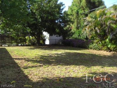 17536 Lebanon Road Fort Myers, FL 33967 - Photo 8 of 10 a view of a large yard with large trees