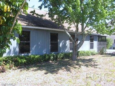 17536 Lebanon Road Fort Myers, FL 33967 - Photo 10 of 10 a front view of a house with garden