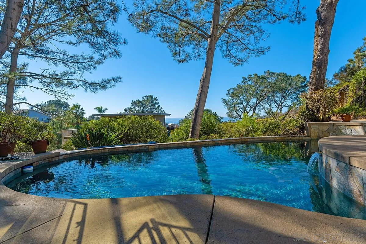 a view of a swimming pool with a lake view