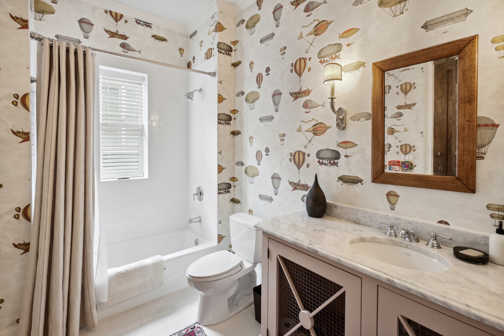 2148 West Giddings Street Chicago, IL 60625 - Photo 23 of 51 a bathroom with a granite countertop sink a toilet and shower