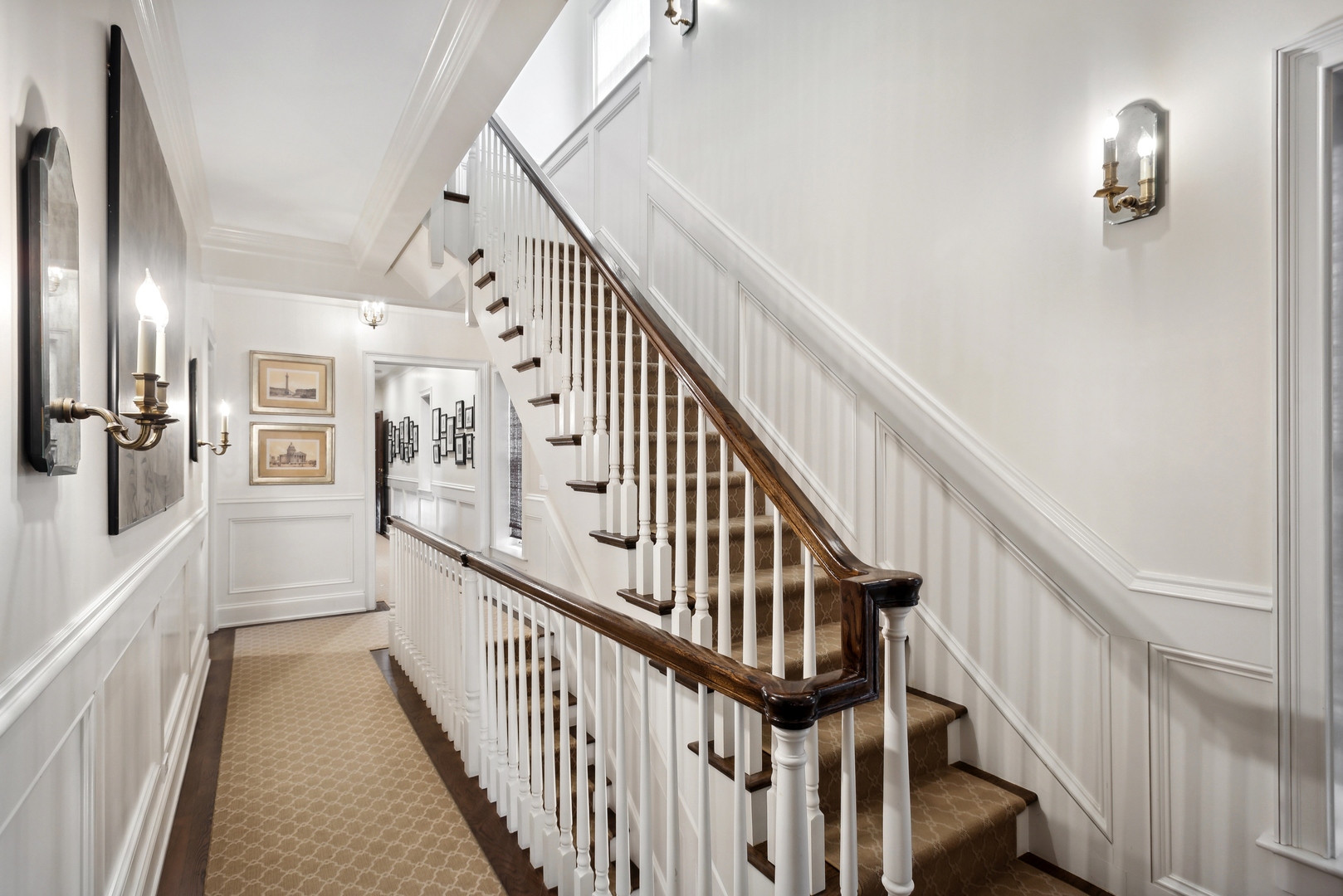 2148 West Giddings Street Chicago, IL 60625 - Photo 28 of 51 a view of staircase with lots of frames on wall and wooden floor