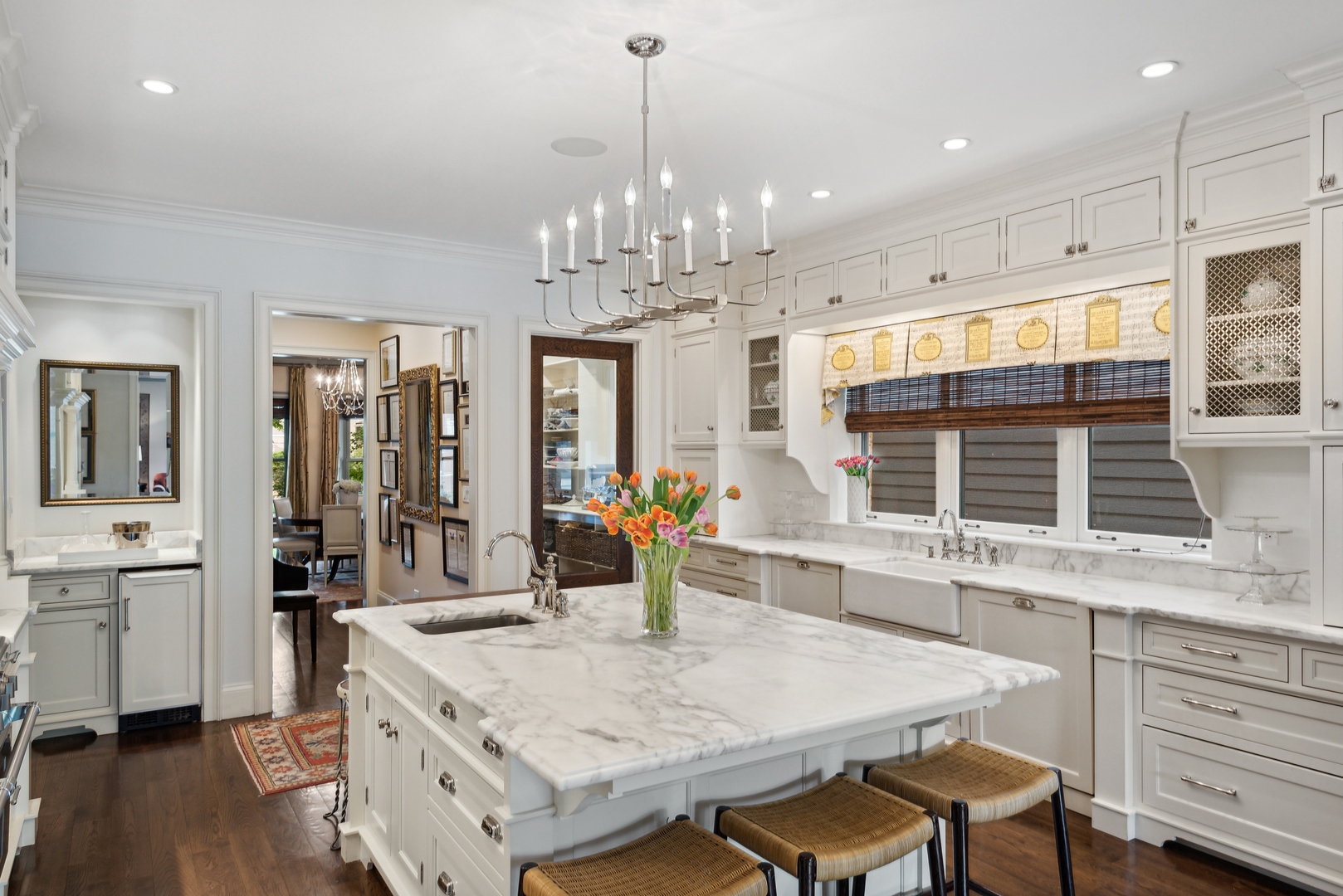 2148 West Giddings Street Chicago, IL 60625 - Photo 5 of 51 a kitchen with stainless steel appliances wooden floor dining table and chairs
