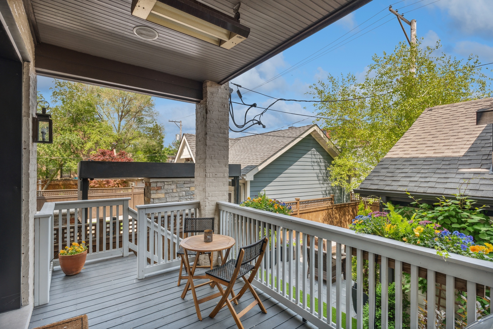 2148 West Giddings Street Chicago, IL 60625 - Photo 9 of 51 a view of a deck with wooden floor and outdoor seating