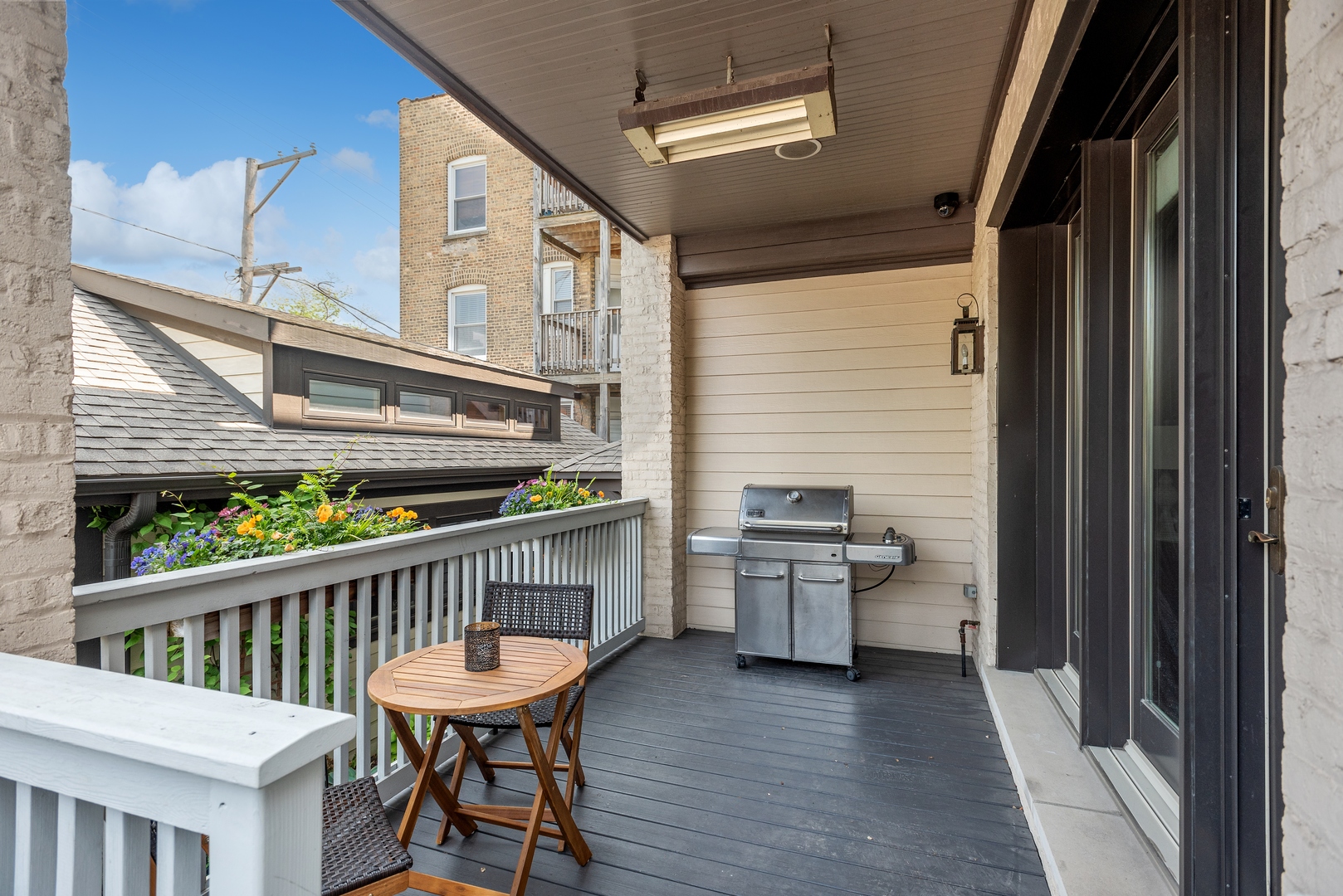 2148 West Giddings Street Chicago, IL 60625 - Photo 10 of 51 a balcony with furniture and wooden floor