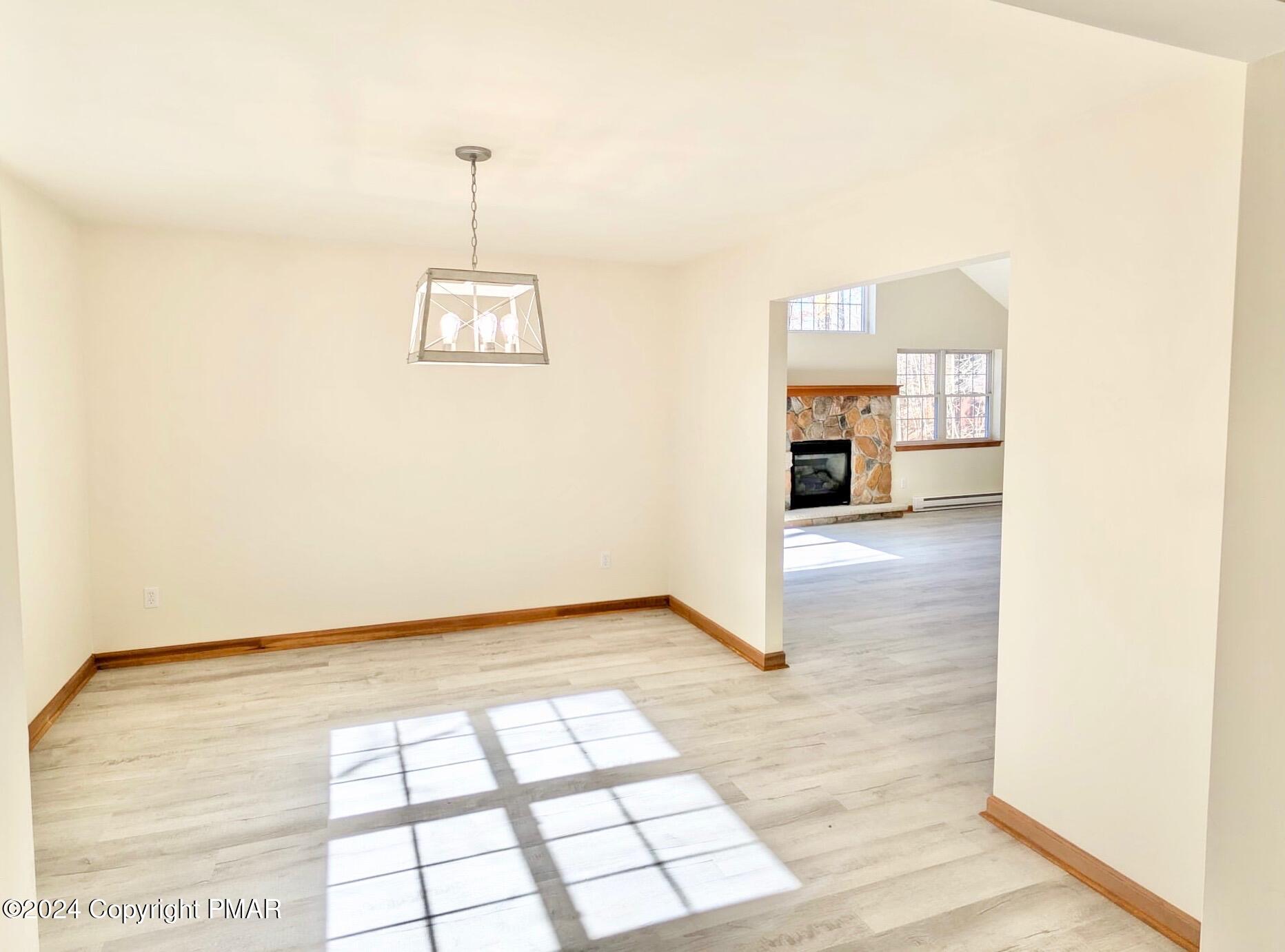 143 Cornwall Place Bushkill, PA 18324 - Photo 14 of 34 a view of a room with wooden floor and windows