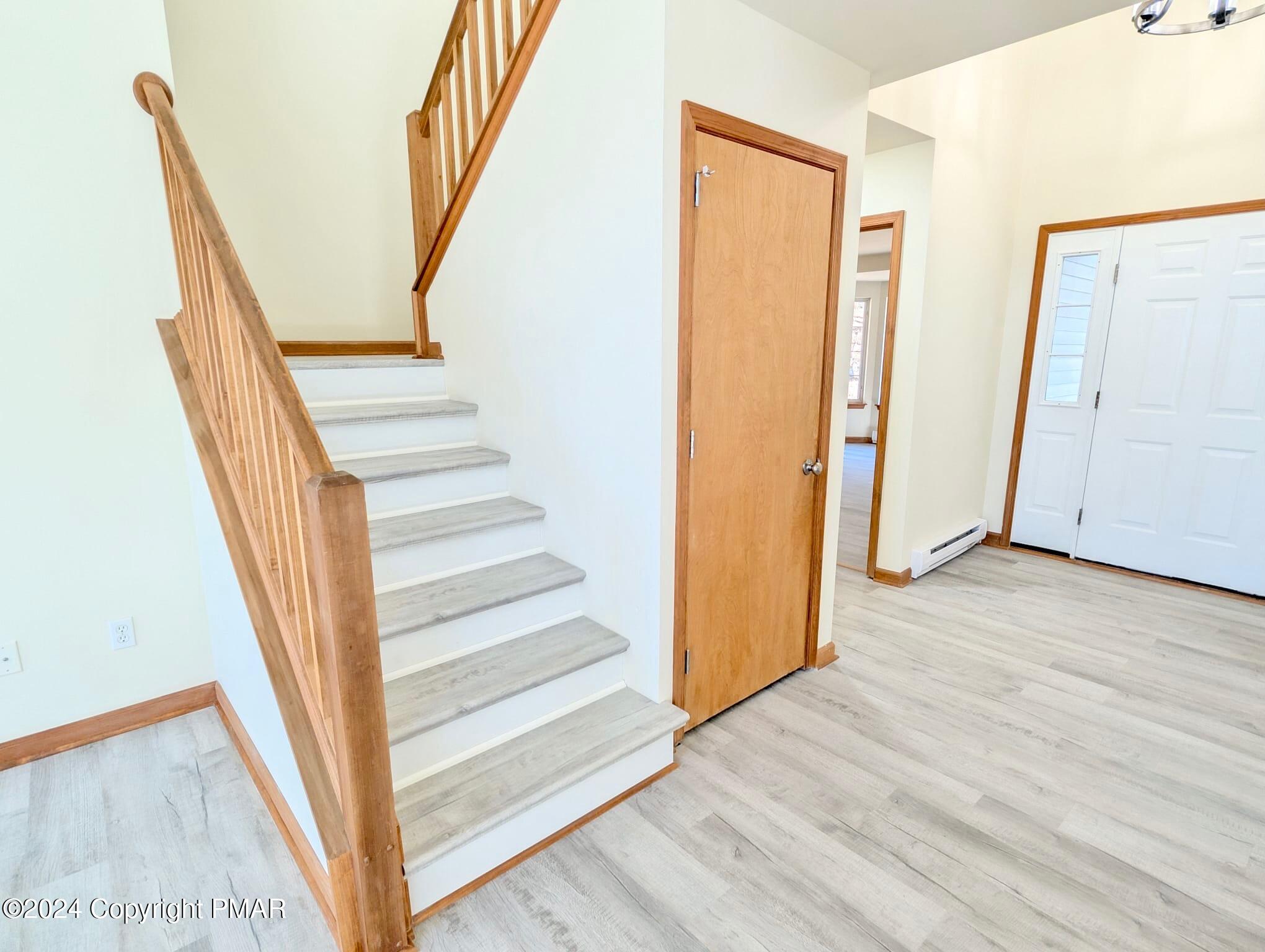 143 Cornwall Place Bushkill, PA 18324 - Photo 23 of 34 a view of staircase with wooden floor and white walls