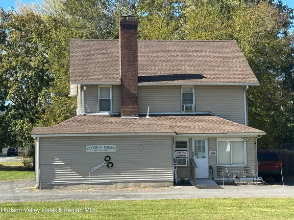 a front view of house with yard