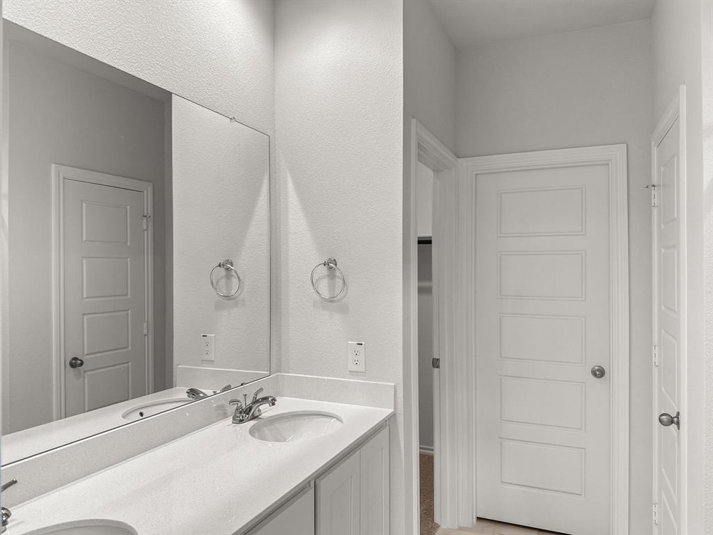 1908 Iris Road Melissa, TX 75454 - Photo 15 of 30 a bathroom with a sink vanity and a mirror