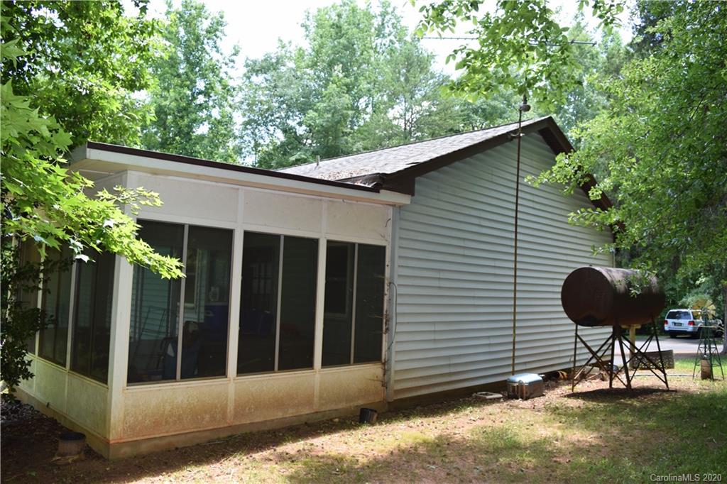 924 Antrim Road Clover, SC 29710 - Photo 2 of 23 a backyard of a house with table and chairs
