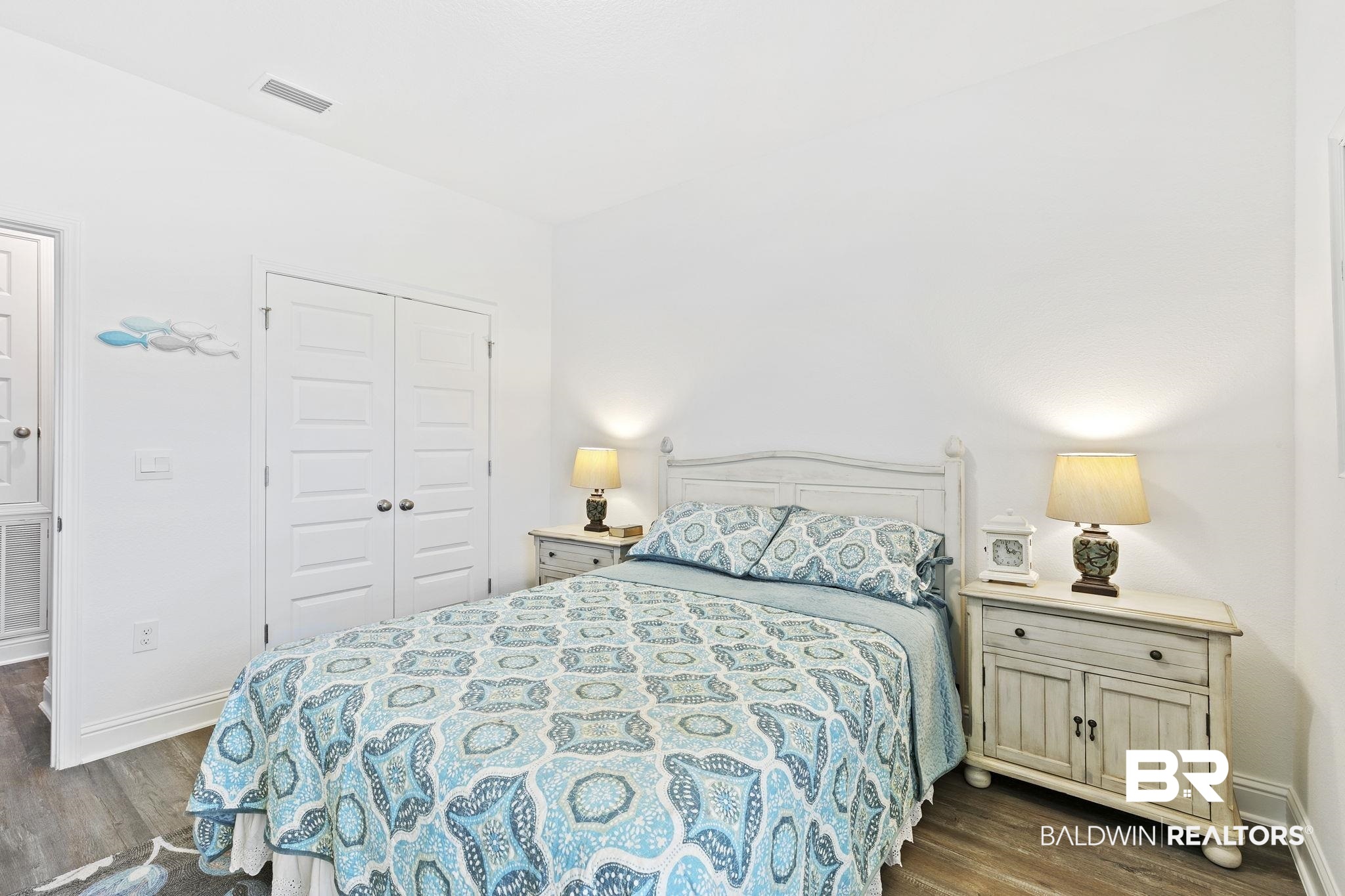 1141 Pencarro Boulevard Foley, AL 36535 - Photo 37 of 70 Bedroom with dark wood-type flooring and a closet