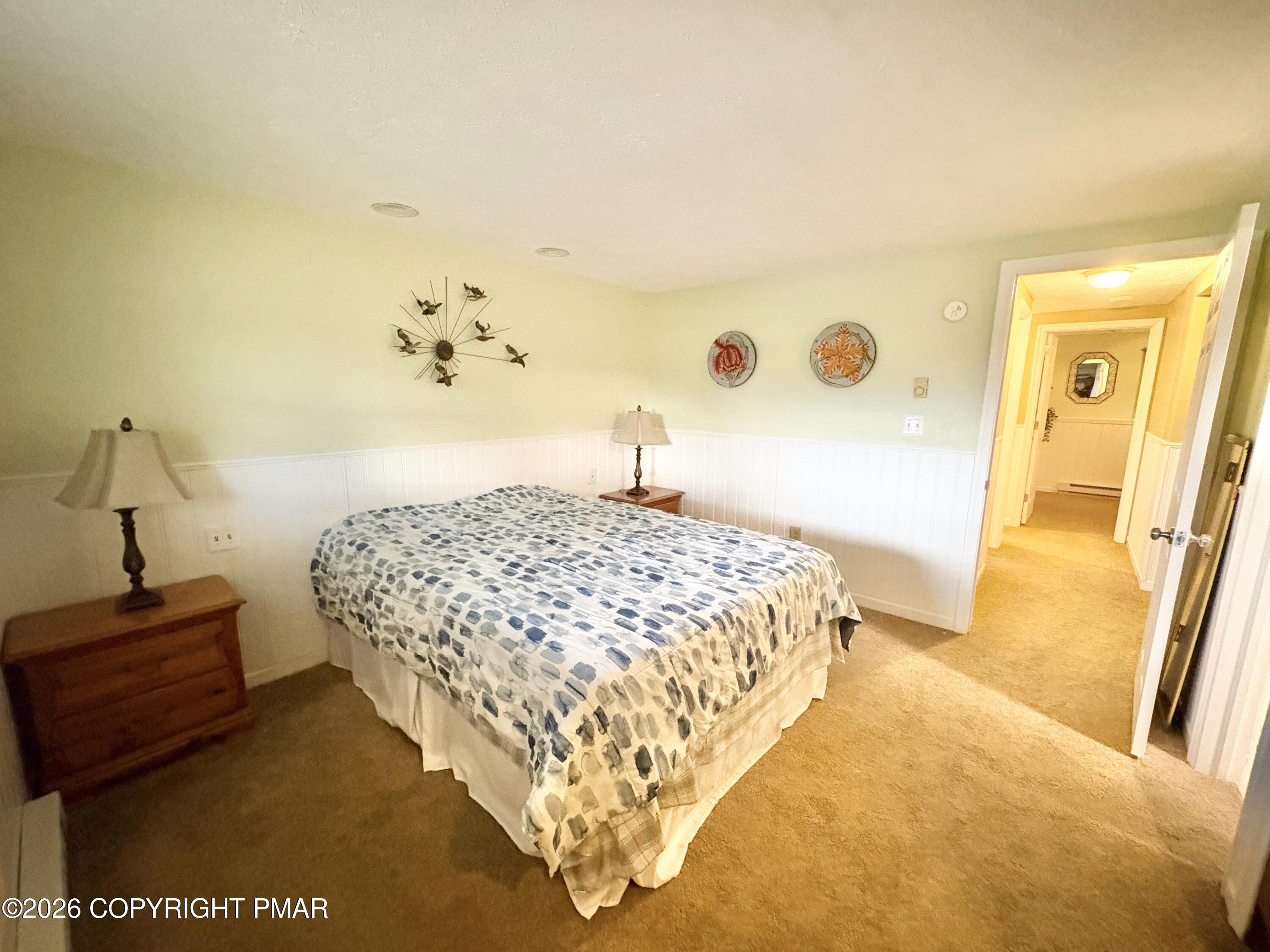 481 Moseywood Road Lake Harmony, PA 18624 - Photo 13 of 20 a bedroom with a bed and a dresser