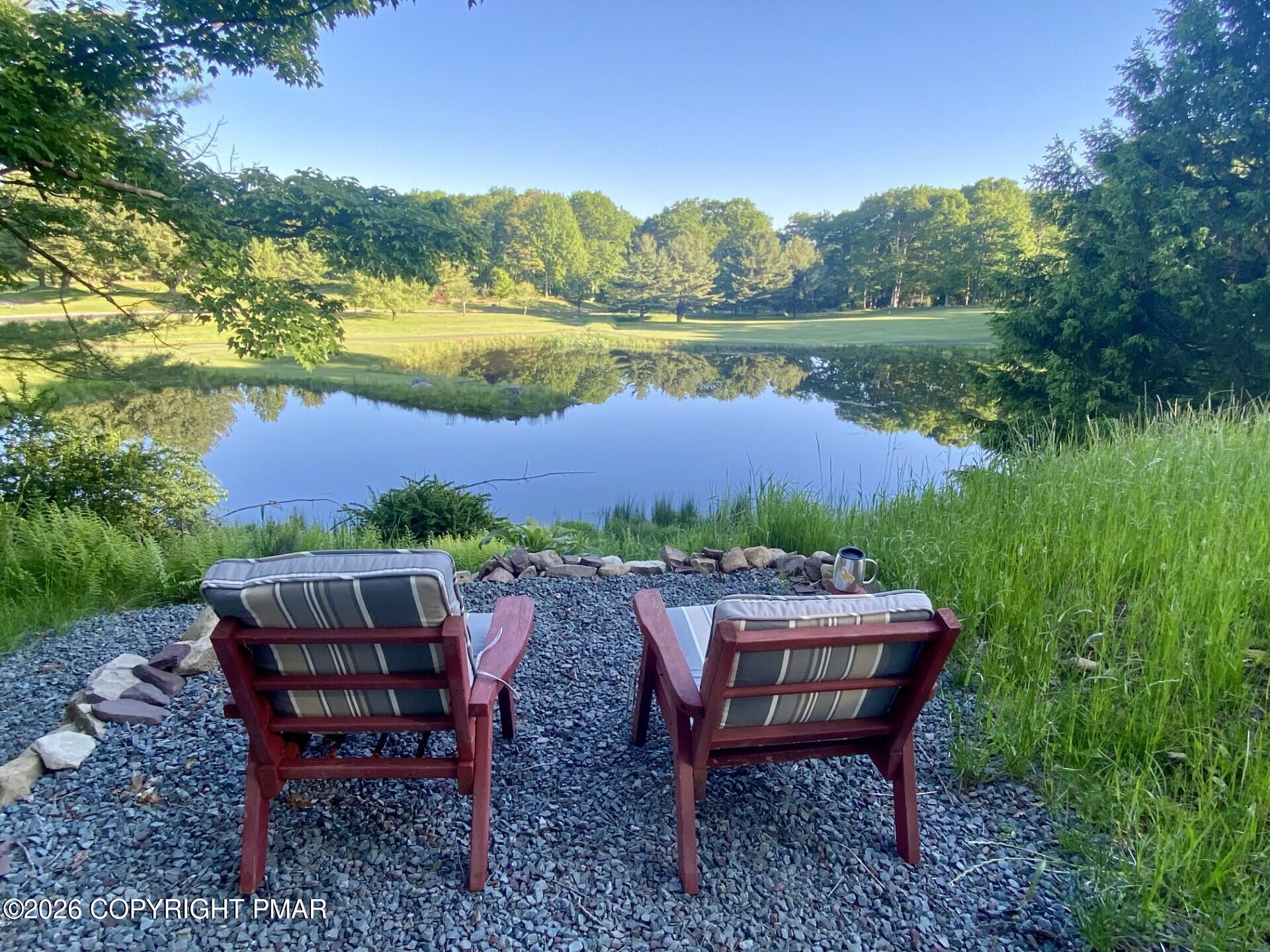 481 Moseywood Road Lake Harmony, PA 18624 - Photo 3 of 20 a view of a backyard with sitting area furniture and lake view