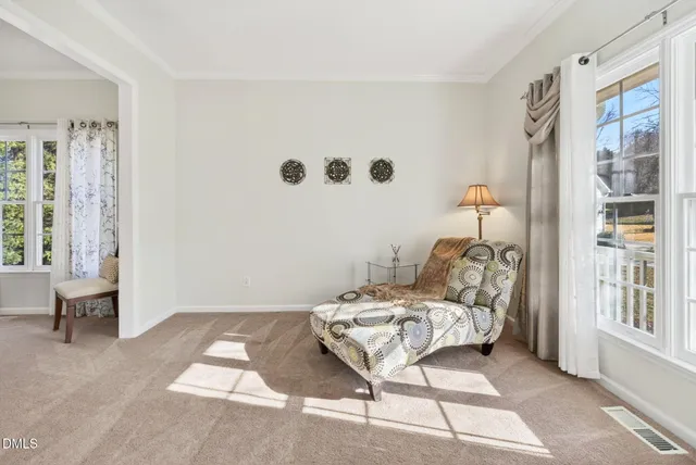 a bedroom with furniture and a chandelier