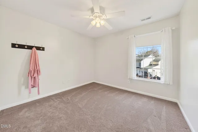 a white toilet sitting next to a shower curtain