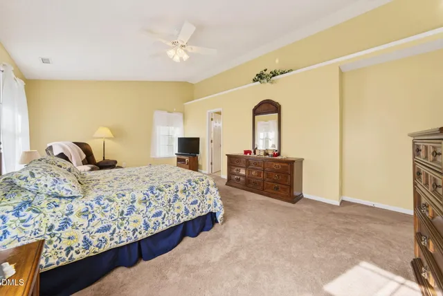 an aerial view of a house with a yard and a fountain