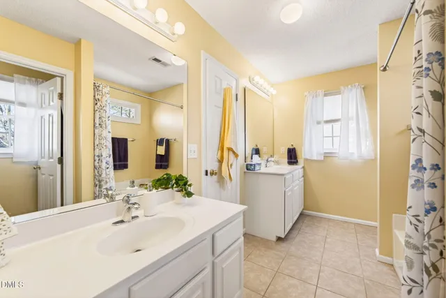 a view of a balcony with two chairs and a table