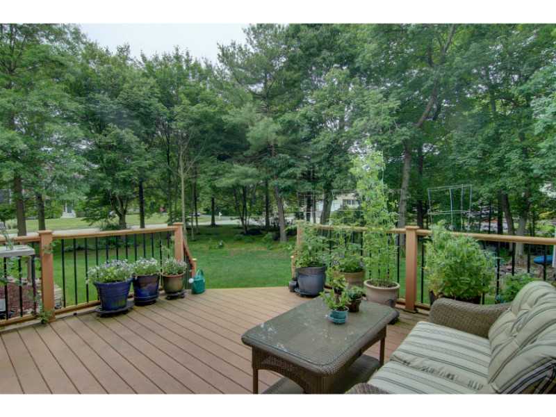 22 Great Road Barrington, RI 02806 - Photo 18 of 23 Patio/Deck. Lovely deck overlooks fabulous lot complete with fire pit, horseshoe, shed, stone walls
