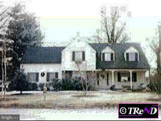 4 Brookhaven Road Wallingford, PA 19086 - Photo 1 of 1 a front view of a house with garden