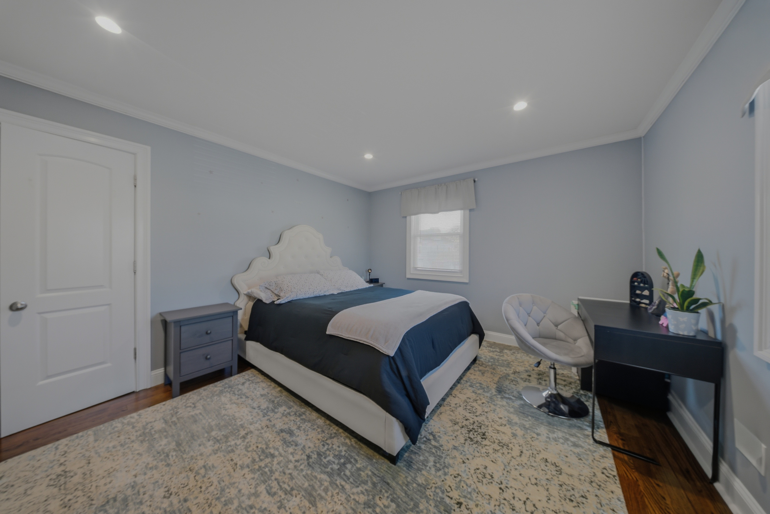 1473 Wood Avenue Bridgeport, CT 06604 - Photo 15 of 40 a bedroom with a bed table chair and a window