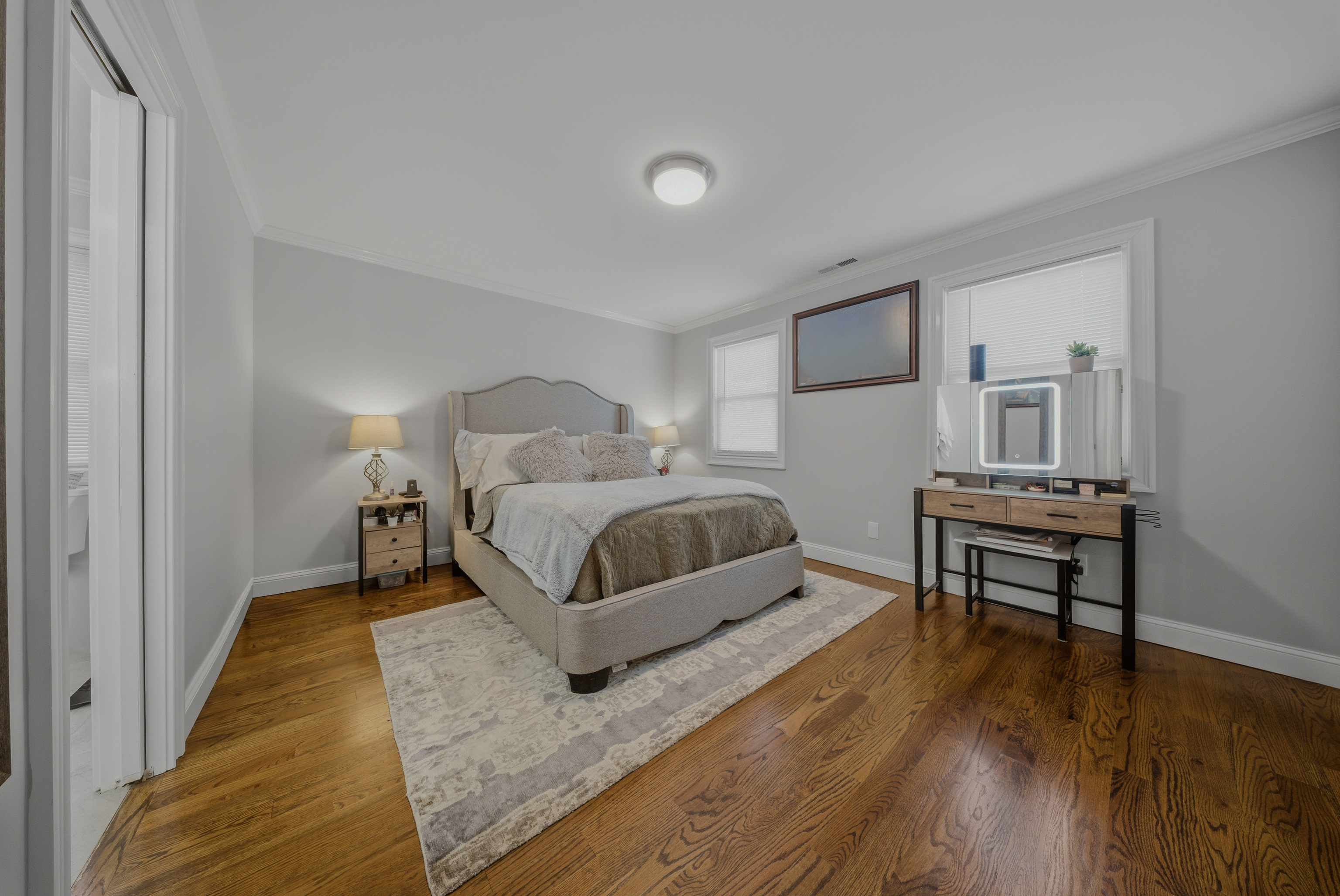 1473 Wood Avenue Bridgeport, CT 06604 - Photo 16 of 40 a bedroom with a bed and a night stand