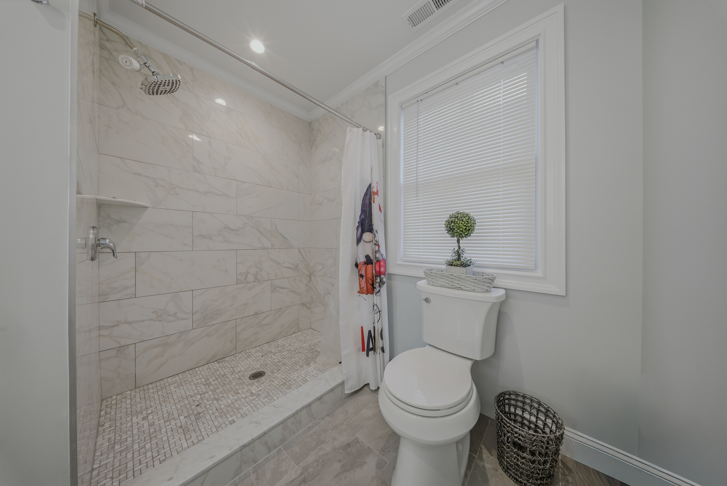 1473 Wood Avenue Bridgeport, CT 06604 - Photo 18 of 40 a bathroom with a toilet and a shower