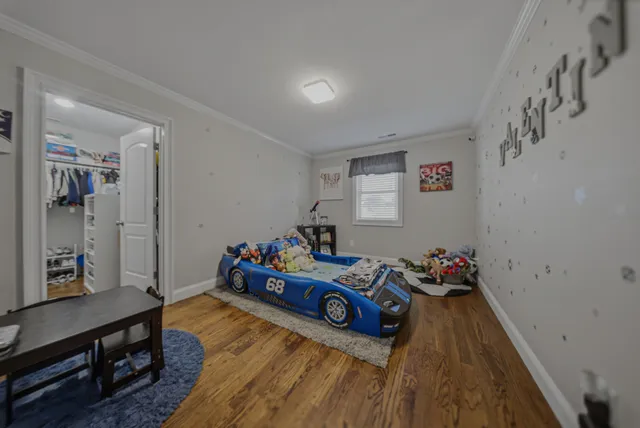a bed room with furniture and a window