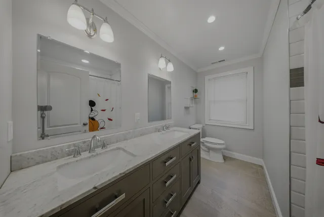 a view of a storage and utility room with washer and dryer