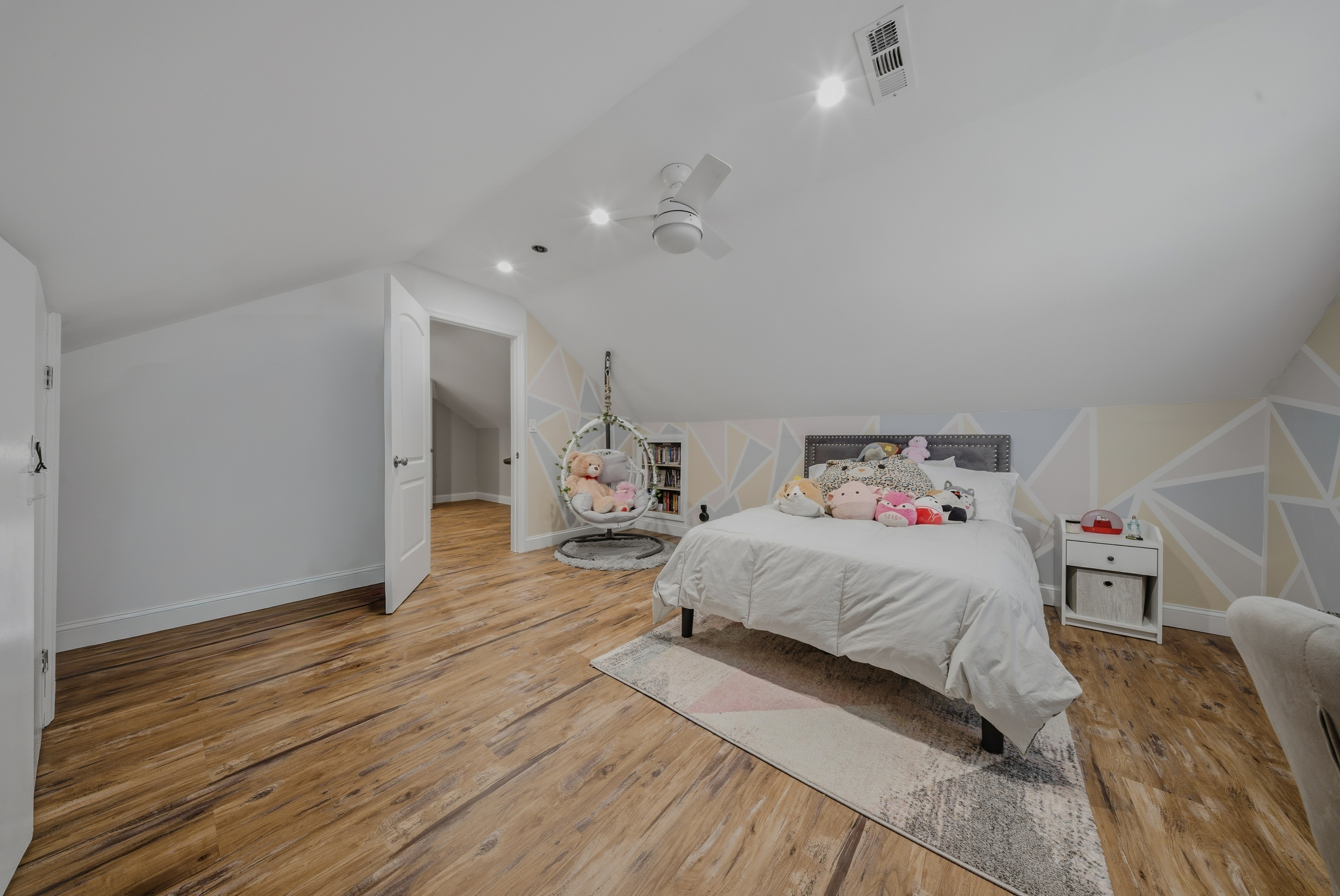 1473 Wood Avenue Bridgeport, CT 06604 - Photo 25 of 40 a bedroom with a bed and wooden floor