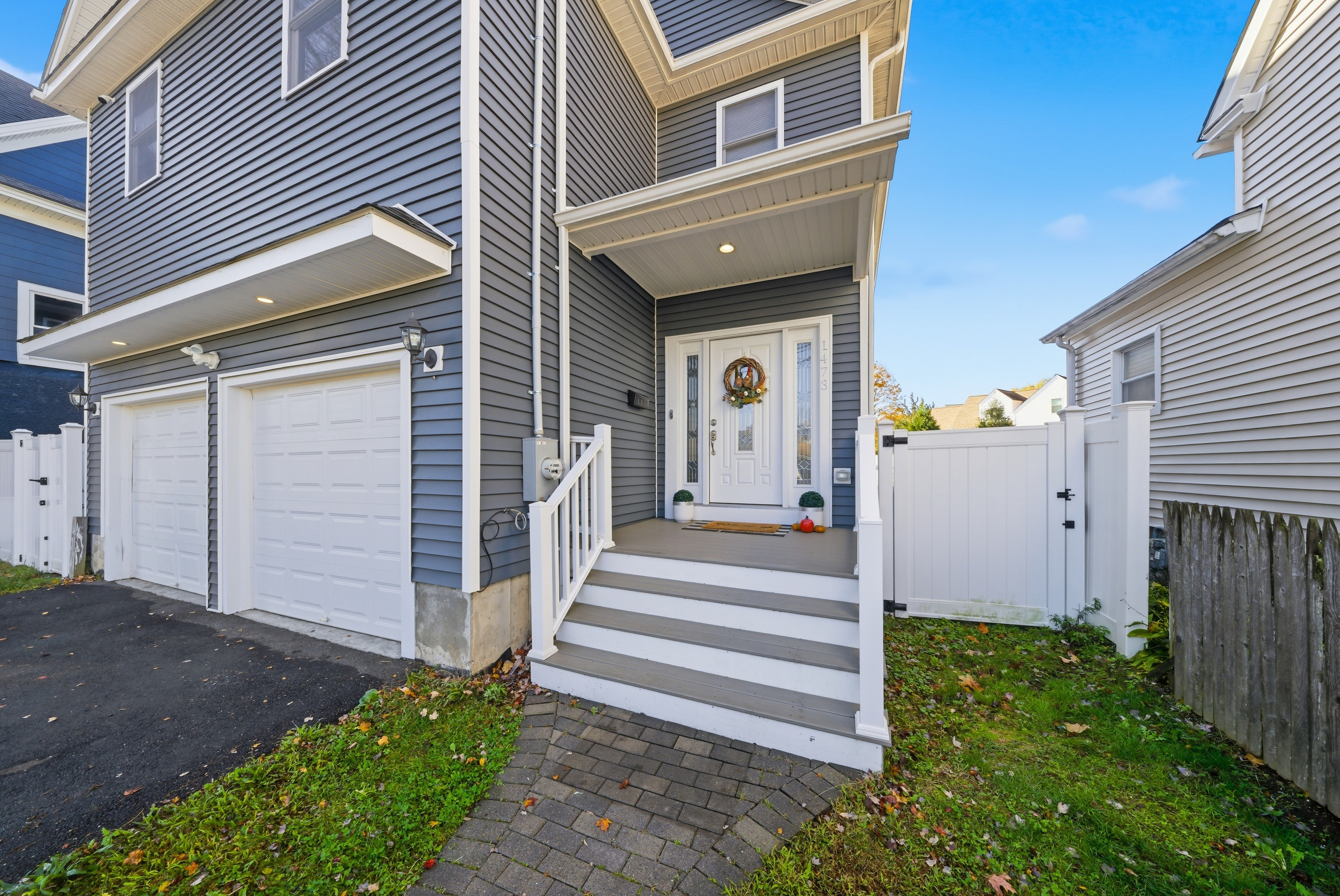 1473 Wood Avenue Bridgeport, CT 06604 - Photo 4 of 40 a front view of a house with a yard