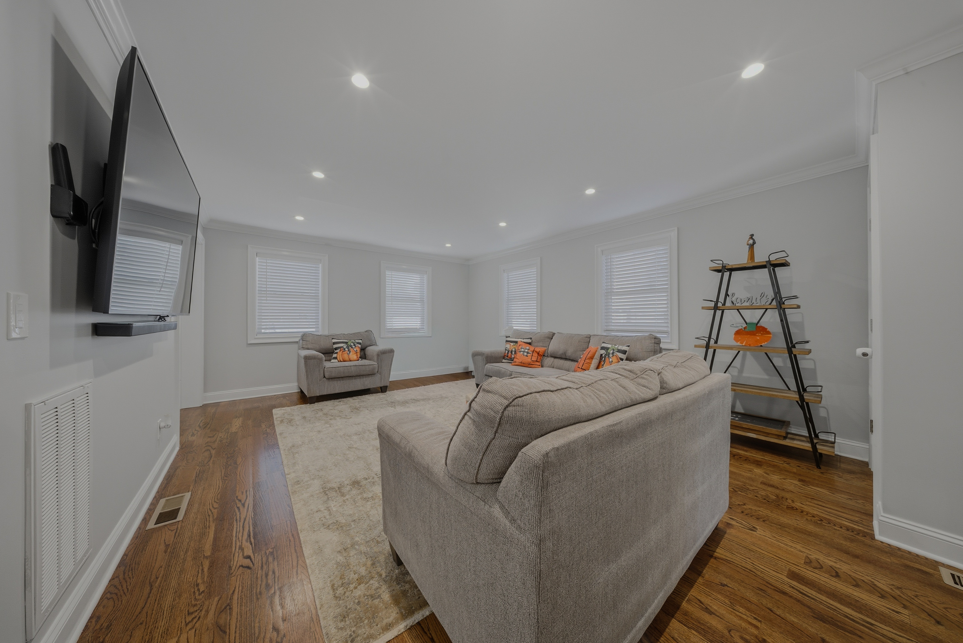 1473 Wood Avenue Bridgeport, CT 06604 - Photo 7 of 40 a living room with furniture and a flat screen tv