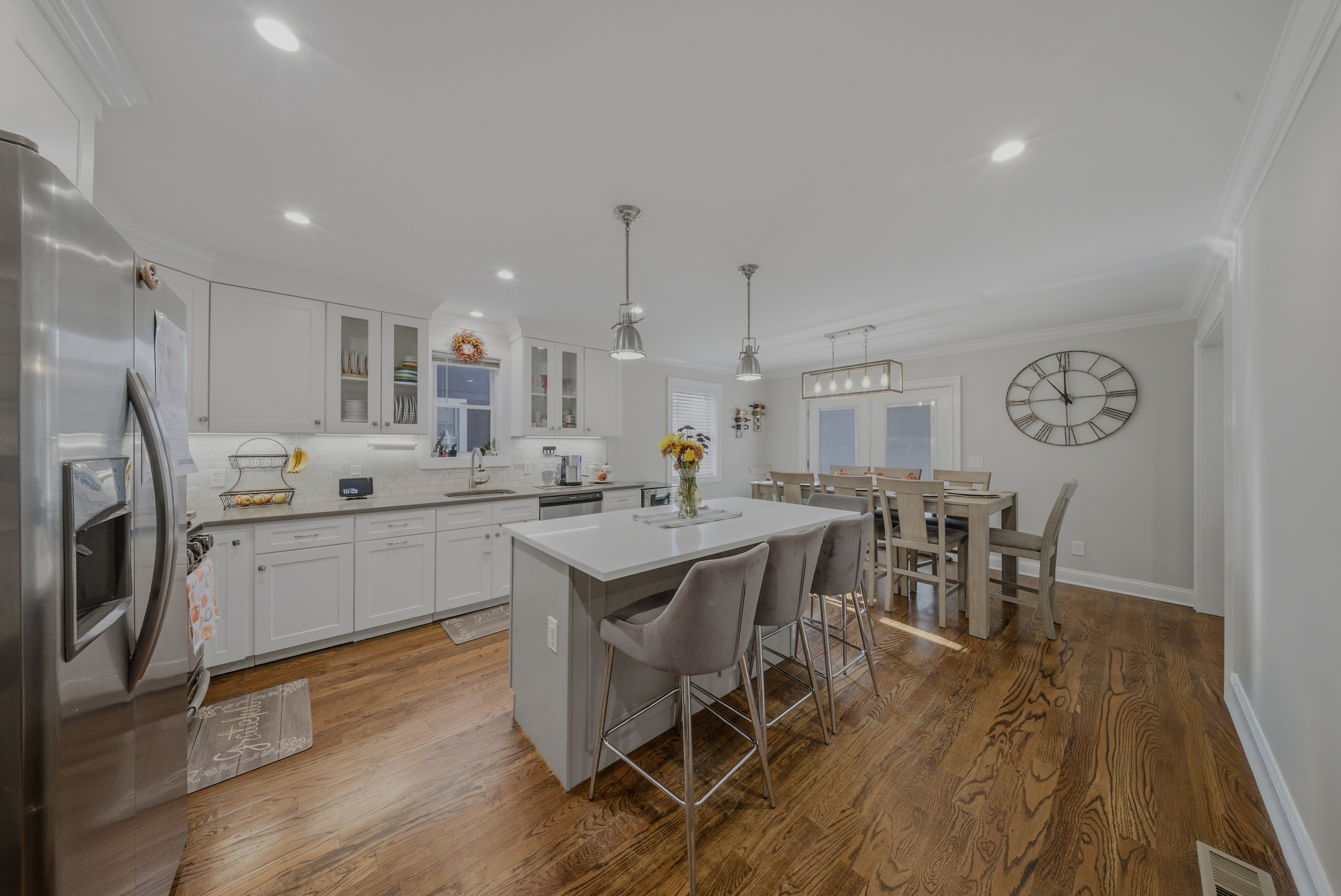 1473 Wood Avenue Bridgeport, CT 06604 - Photo 9 of 40 a large kitchen with a table and chairs