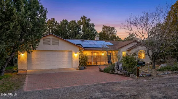 a view of a house with a yard and garage
