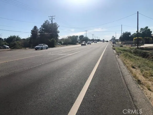 a view of a street with cars on road