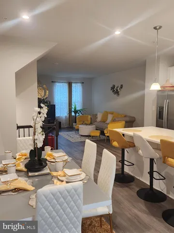 a living room with lots of furniture and gym equipment