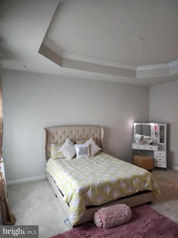 a bedroom with a bed and lamp