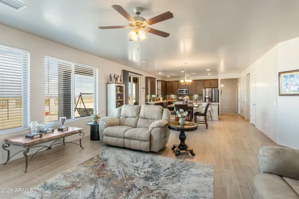 a living room with furniture and a large window