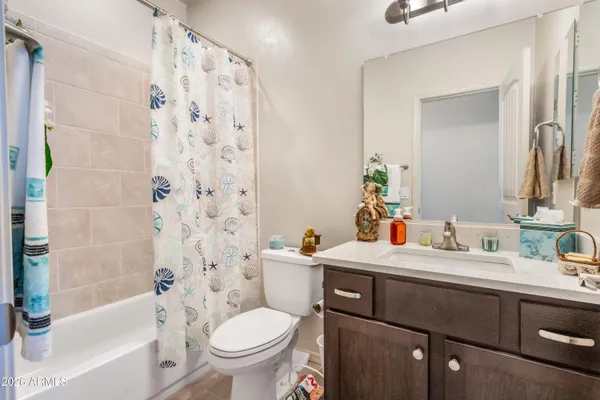 a bathroom with a sink a toilet and a bathtub